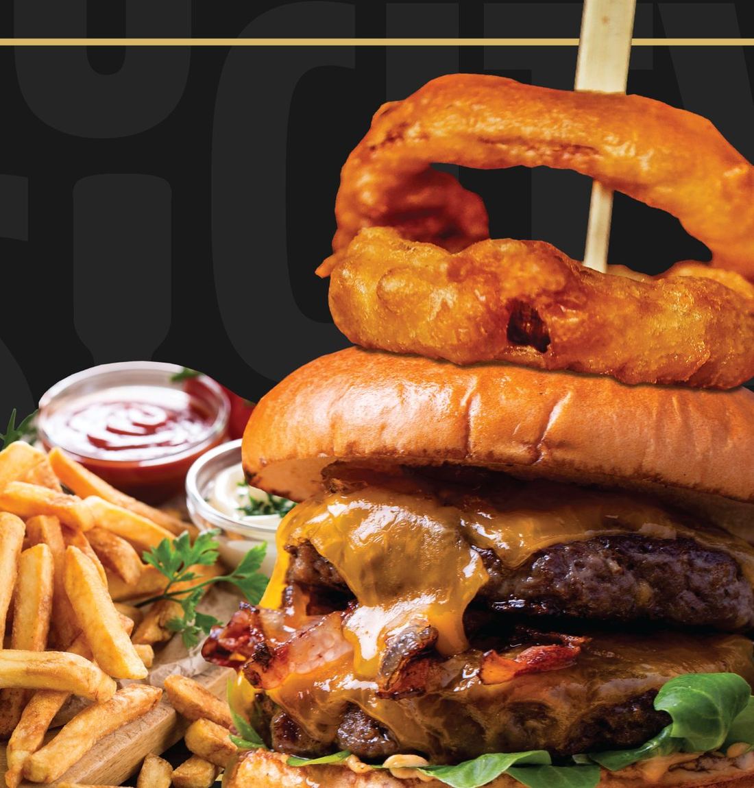 A stacked cheeseburger with onion rings